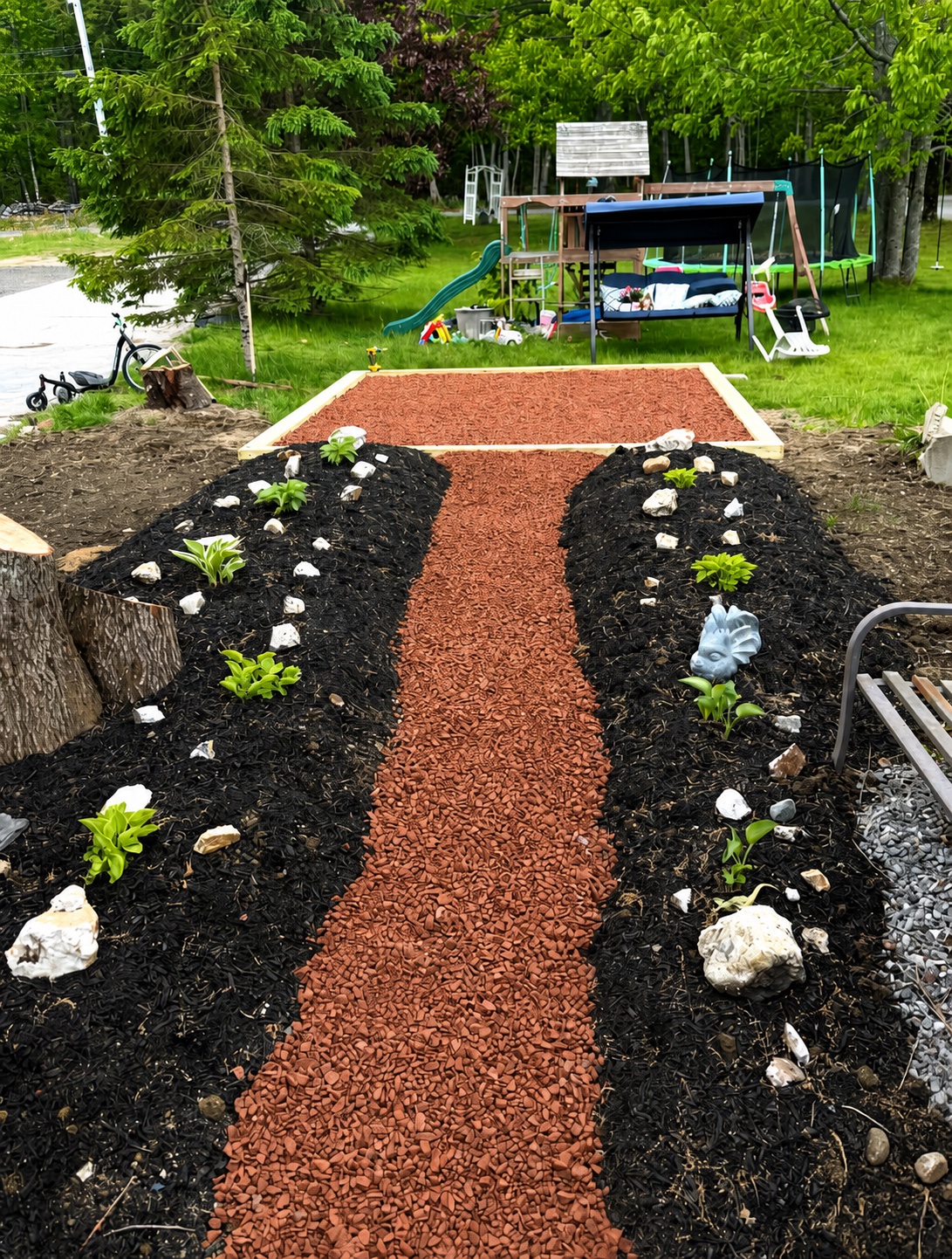 Red aggregate garden walkway and landscaped beds