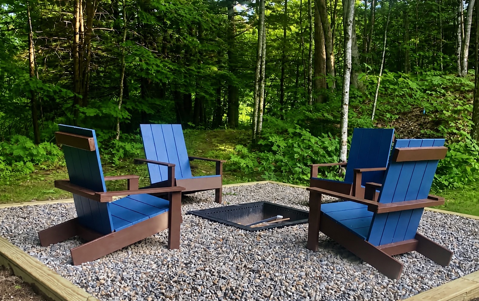 Gravel firepit area with Adirondack chairs