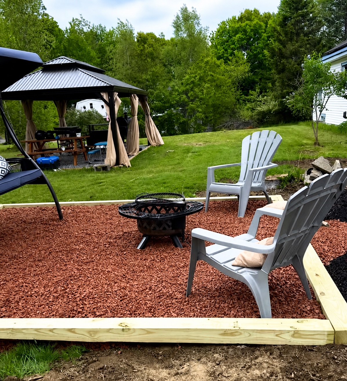 Red stone patio and firepit seating area